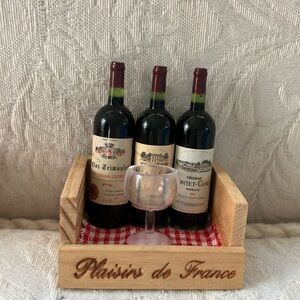 Adorable handmade French refrigerator magnet featuring three bottles of red wine